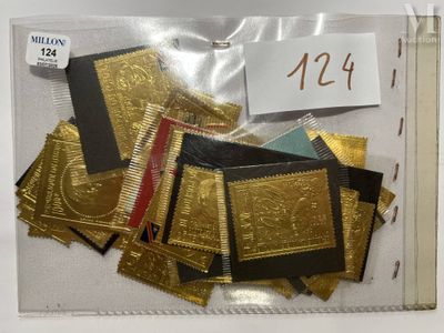 a lot of gold and black cards in a clear bag