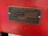 a close up of a red machine with a label on it