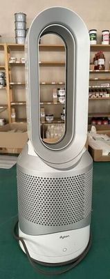 an image of a room heater sitting on top of a green table