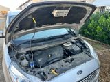 a car with its hood open and the engine in the trunk