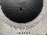 a close up of a metal object on top of a wooden table