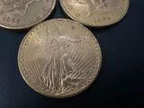 three coins sitting on top of each other on a table