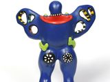 a figurine of a blue man with a red hat on his head