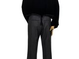 a male mannequin dressed in a black jacket and pants