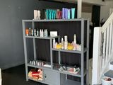 a room that has a shelf with many different items on it