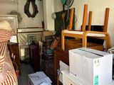 a refrigerator and a refrigerator freezer in a garage