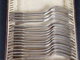 a lot of spoons in a box on the table