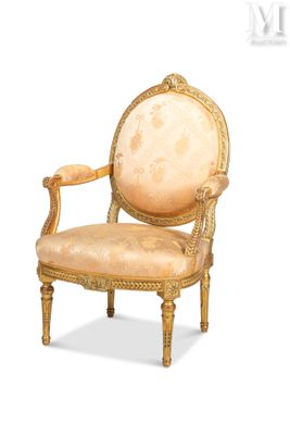 an image of a chair with a beige upholstered seat and gold trim
