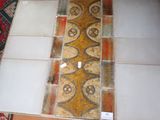 a tile floor that has been cleaned and is in the process of being cleaned