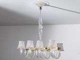 a clear glass chandelier hanging from the ceiling