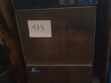 a silver dishwasher sitting on a counter in a kitchen