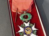 an image of a medal in a case with a ribbon around it