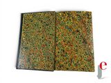 a close up of an open book with a pattern on it