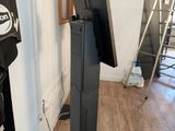 a flat screen tv on a stand in a room