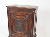 an old wooden cabinet with carvings on the front and sides