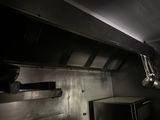 a kitchen with a stove and a microwave in it