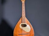 a small guitar that is sitting on a table