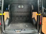 the back of a van with the door open and the cargo compartment in the back