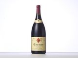 a bottle of red wine sitting on top of a table