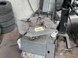 a machine that is sitting on the ground in a garage