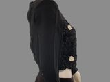 the back of a mannequin wearing a black top and black pants