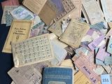 a box full of old papers and a book on a table