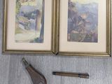 two paintings on the wall next to a pair of scissors