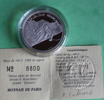 a close up of a piece of paper with a coin on it