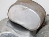a close up of a pile of rocks on a white surface