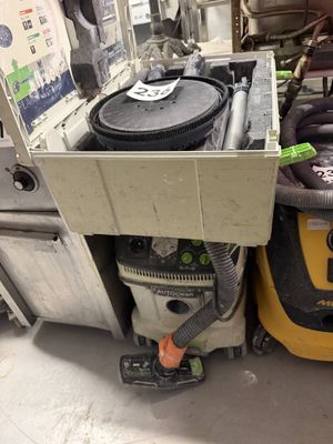 a machine that is sitting on the floor next to other machines