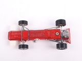 an overhead view of a red toy race car on a white surface