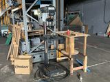 a picture of a forklift in a warehouse with pallets and boxes