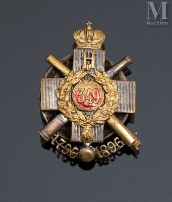 an image of a badge with a crown on top of it