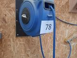 a blue air blower attached to a wall