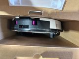 a box with a vacuum cleaner inside of it