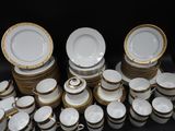 a lot of plates and cups that are stacked together