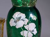 two vases sitting next to each other on a table