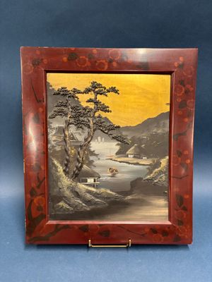 une image représentant une photo d'un tableau dans un cadre en bois