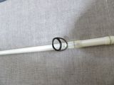 a white pipe with a black ring on top of it