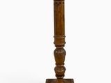a wooden pedestal with a wooden top and a wooden base