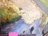 un tableau représentant un homme et un chien devant un tableau représentant un homme et un chien