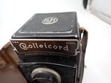 an old camera with a box on top of it