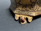 a gold and black box with a dog head on it