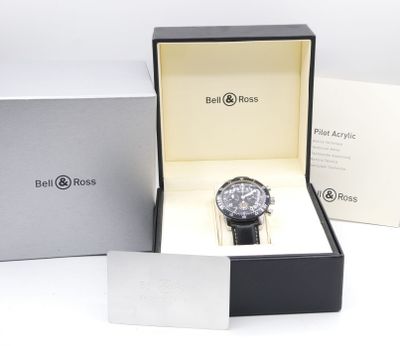 the watch is in a box with the box open on the table