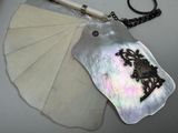 a picture of a necklace with a picture of a woman on it