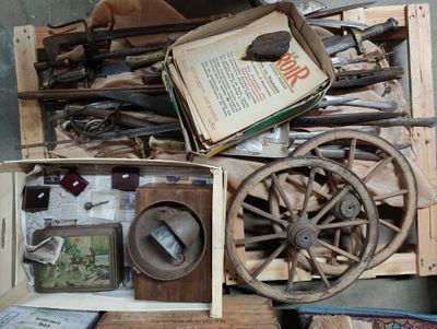 a wooden box filled with assorted items on a table