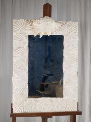 a picture of an easel with a mirror on it