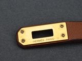 hermes paris brown leather and gold plated key foble