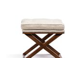 a wooden bench with a cushion on top of it