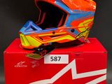 a close up of a red box with a helmet on it